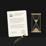 Signed property contract and pen beside an hourglass with the sand almost run out