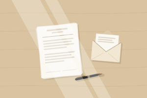 estate-papers-pen-envelope Tidy desk with a stack of papers, a pen and an open envelope in soft natural light